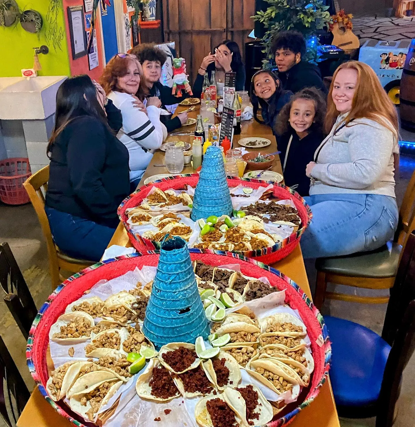 The La Vecindad family around a table of tacos