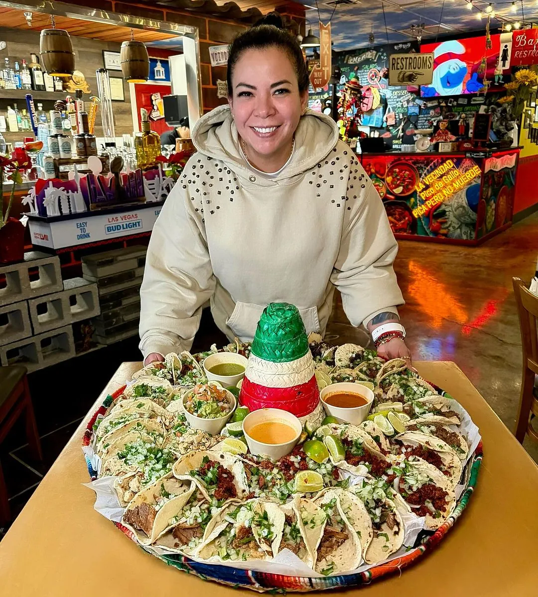 Vanessa Barreat serving a large taco platter
