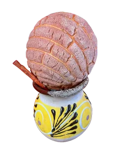 Concha on a café de olla cup